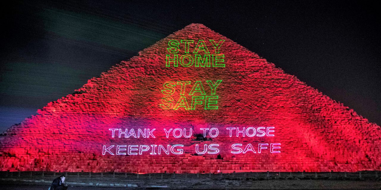 Great Pyramid of Giza lightened up with "Stay Safe - All United" messages for doctors and public workers after Egypt imposes lockdown measures - photo: AFP